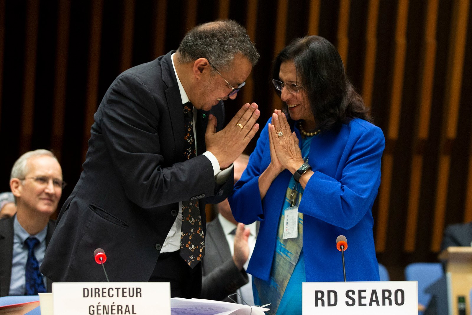 WHO Director-General and Regional Director for SEARO greet each other by joining their palms and bow their heads.