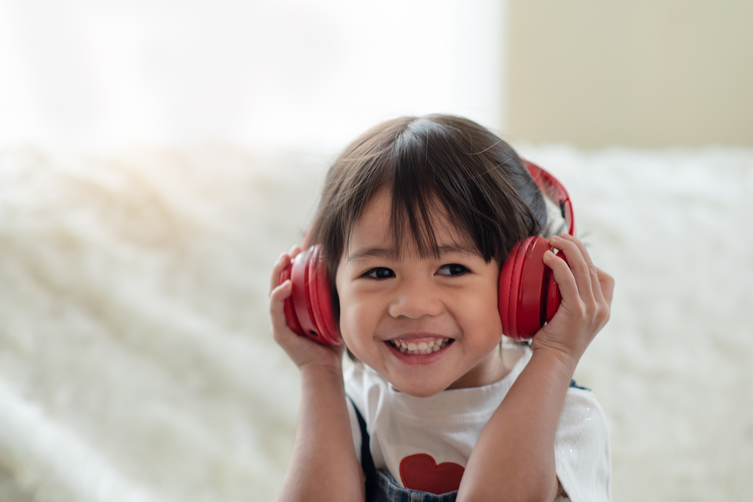 Little girl wearing headphones