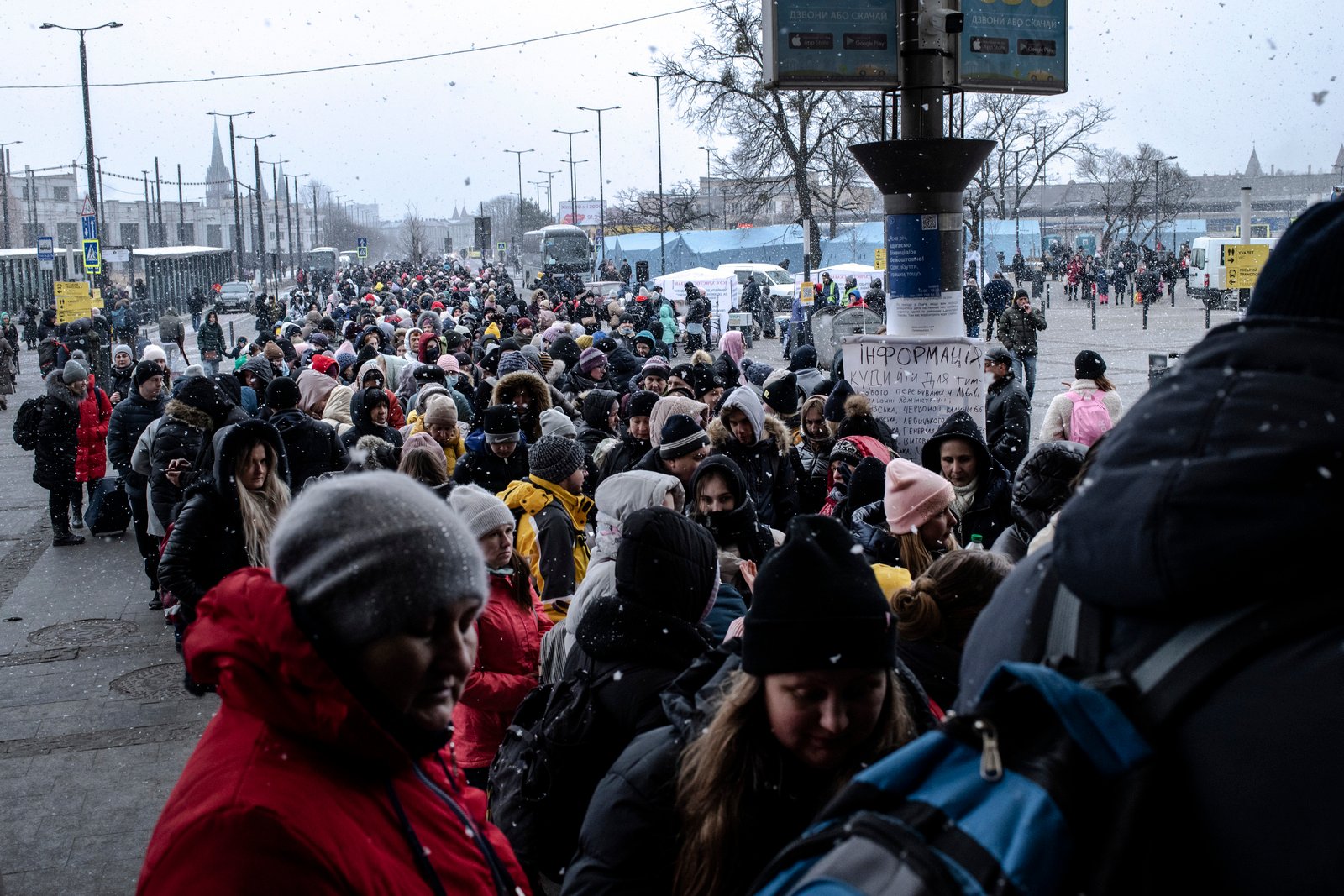 People line up for hours to enter the main railway station in Lviv, Ukraine.